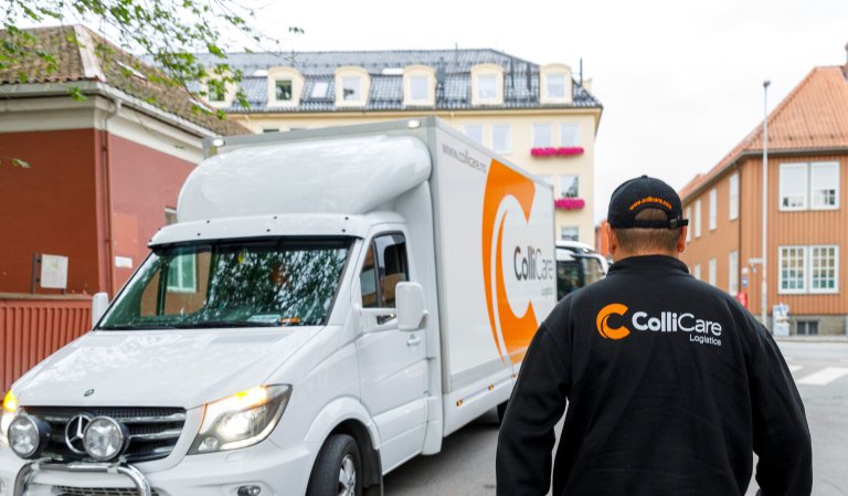 ColliCare driver walking towards ColliCare truck in Trondheim